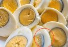 Why does a green ring appear around hard-boiled eggs?